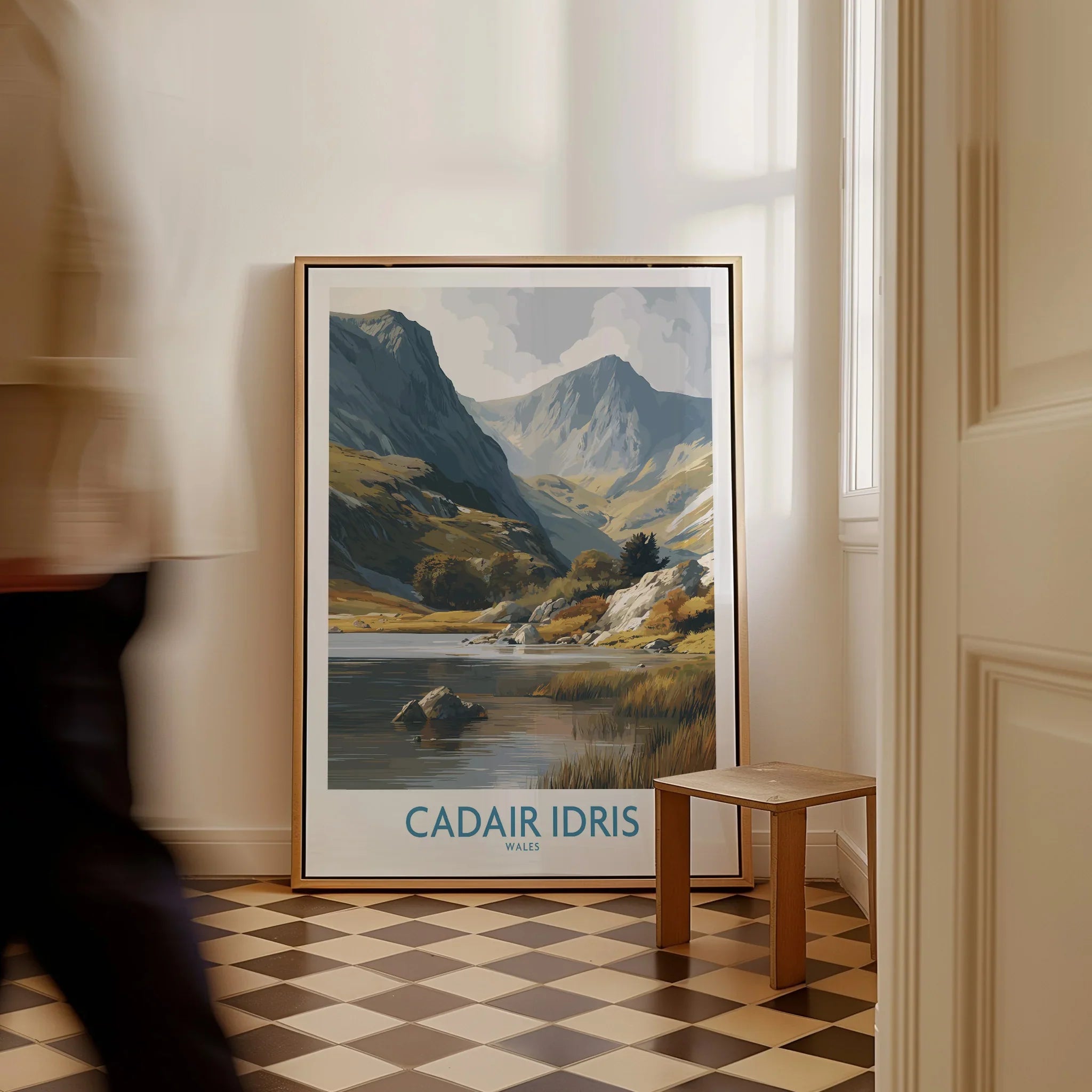Framed Cadair Idris travel poster with mountain landscape, leaning on hallway floor
