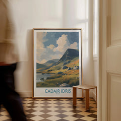 Framed Cadair Idris travel poster with scenic mountain landscape leaning against a hallway wall.