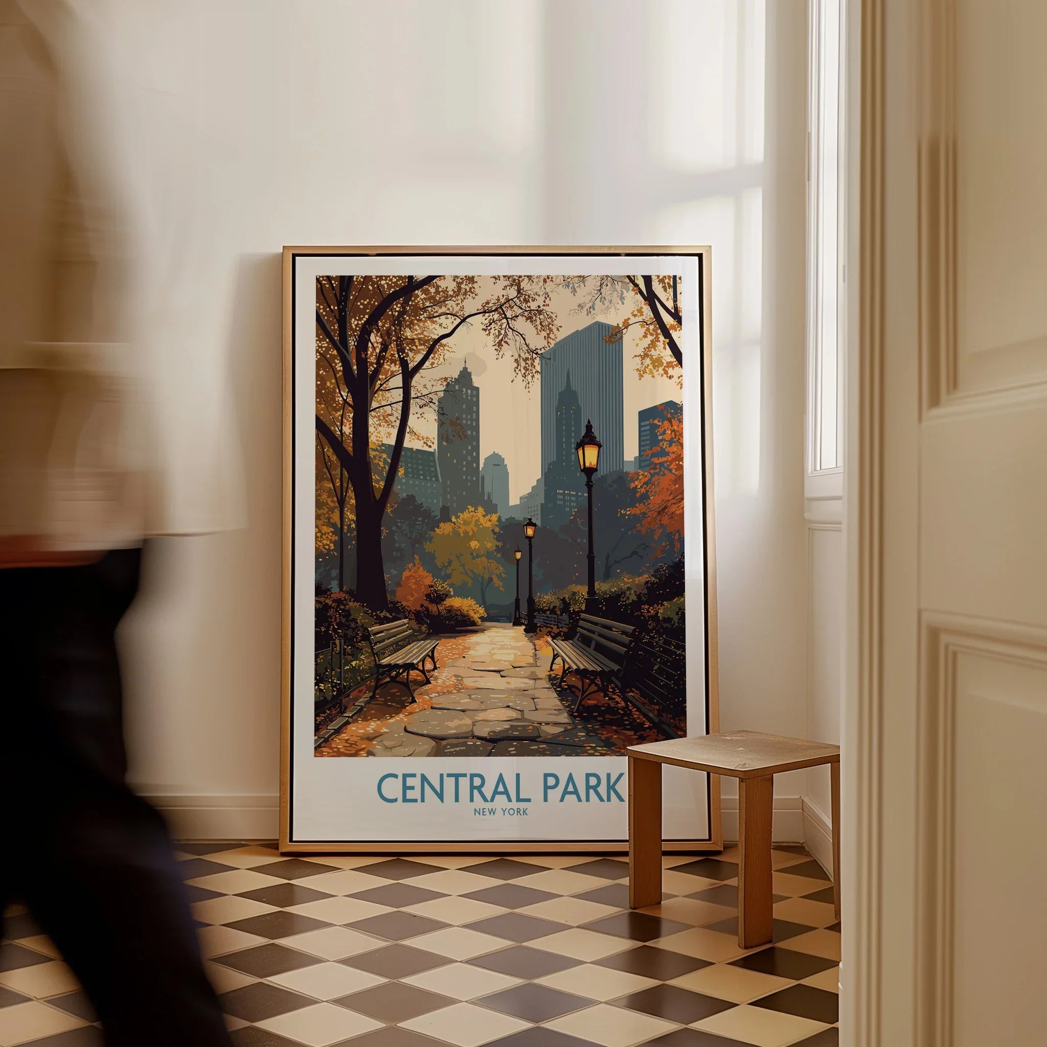 Framed Central Park New York travel poster with city skyline on floor in modern hallway