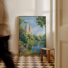 Framed Central Park New York cityscape wall art on floor, man walking past in hallway