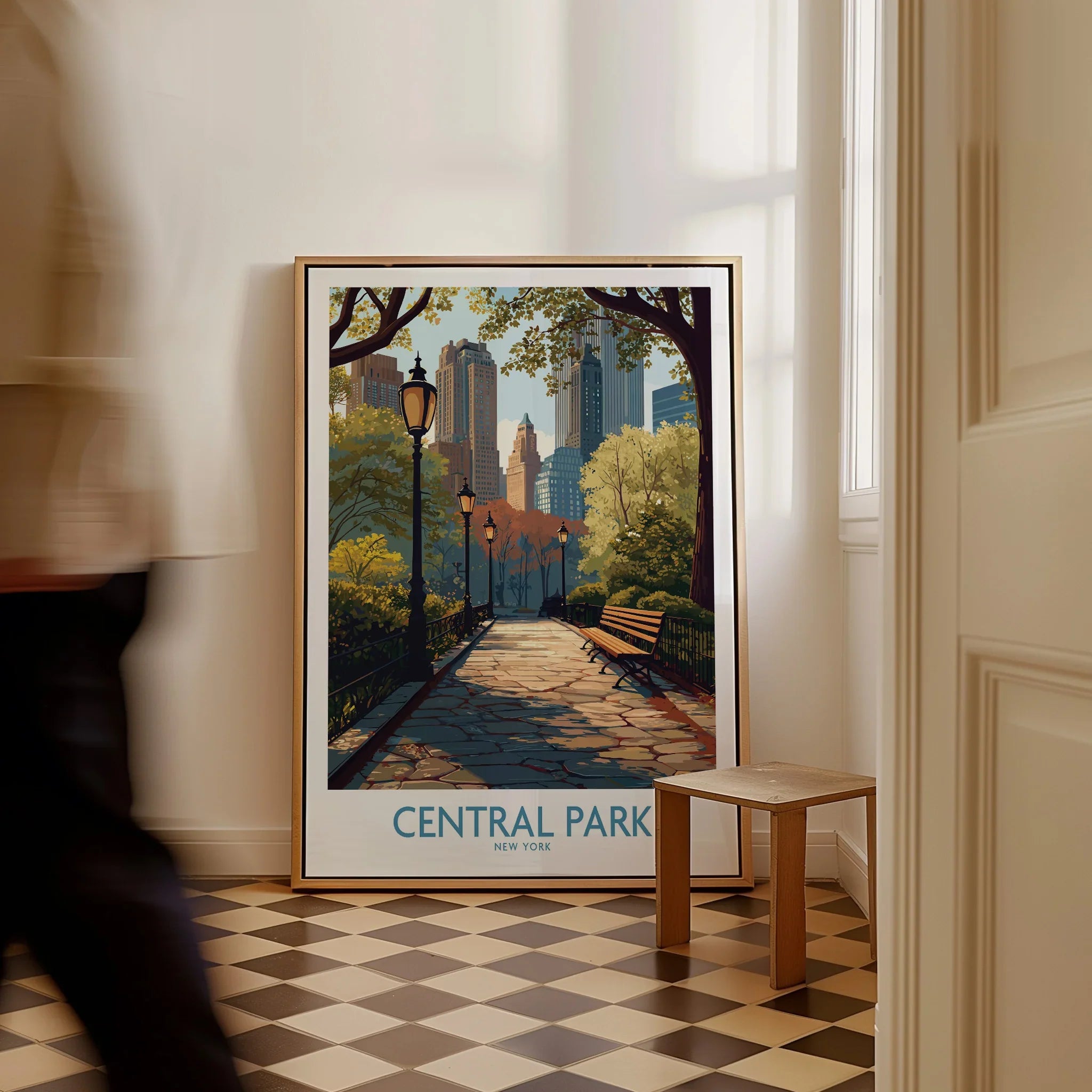 Framed Central Park New York poster with skyline, resting on the floor in a modern room