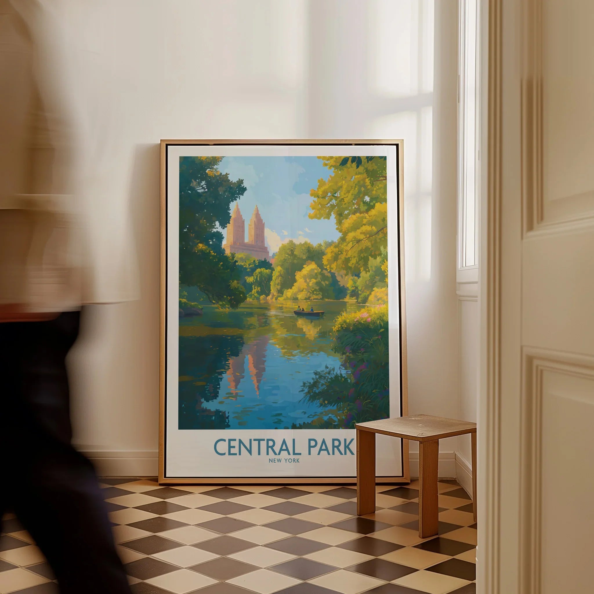 Framed Central Park New York art print on the floor in a bright hallway