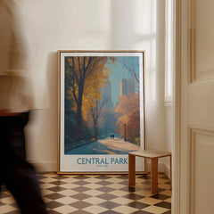 Framed Central Park travel poster with autumn trees, leaning on hallway floor, man walking past