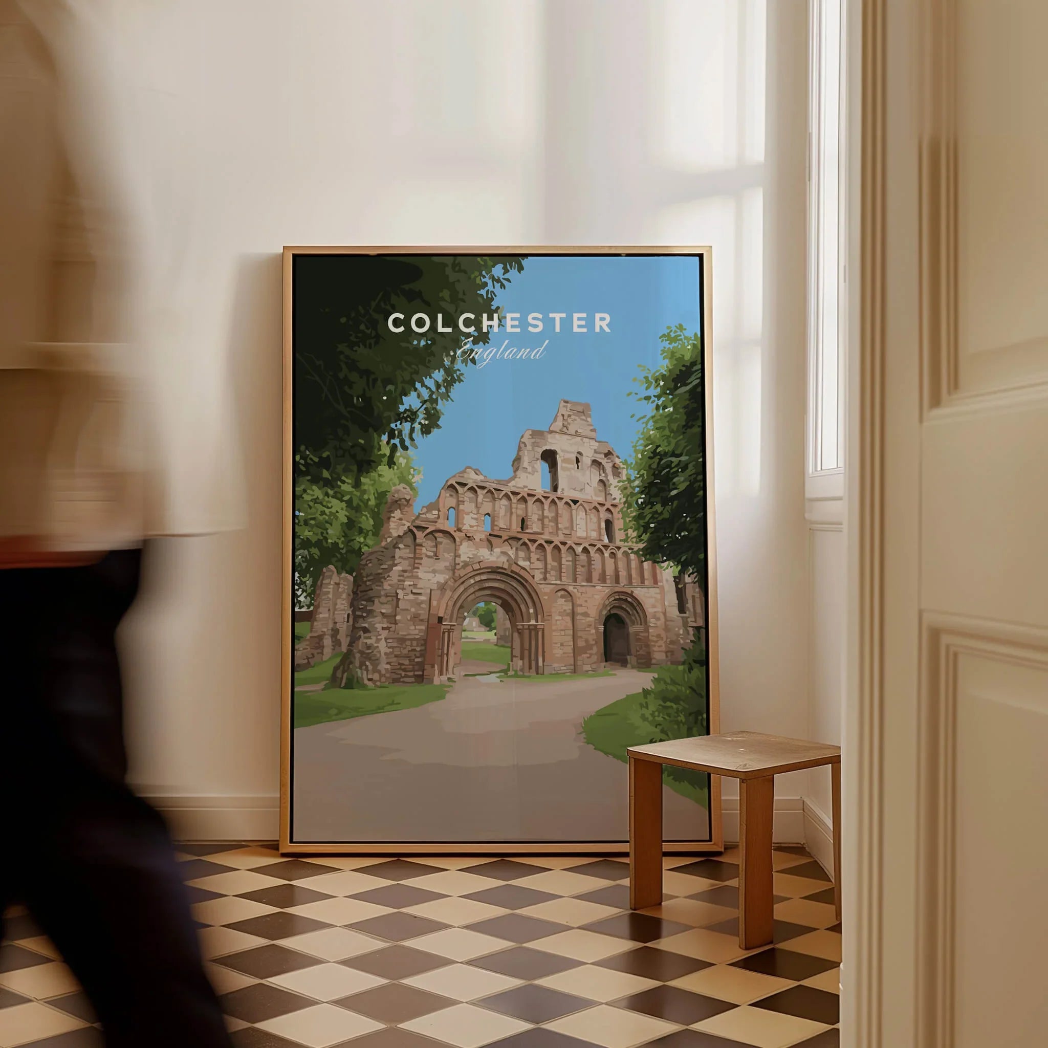 Colchester England travel poster with historic ruins leaning against a wall in a bright hallway