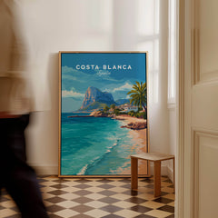 Costa Blanca Spain Travel Art – Mediterranean Village & Turquoise Sea Landscape Poster showcased in an elegant interior setting.