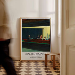 Edward Hopper Nighthawks 1942 Iconic Diner Art Print AIC Poster displayed in a stylish interior setting.