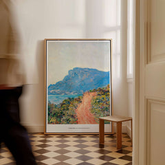 Exhibition Art Print Claude Monet The Corniche near Monaco Impressionist Landscape Poster displayed in an elegant interior.