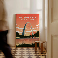 Framed Gateway Arch National Park travel poster leaning on wall in sunlit room