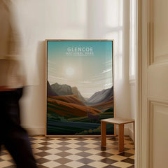Framed Glencoe National Park print with mountains and stag, leaning on floor in modern hallway