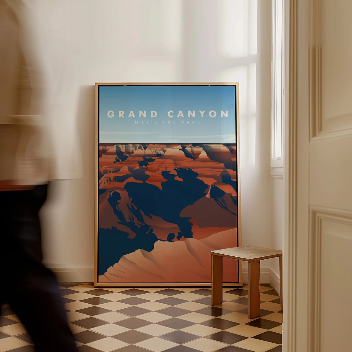 Framed Grand Canyon National Park travel poster on floor in modern hallway