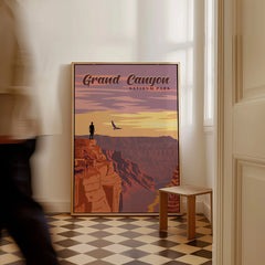 Grand Canyon National Park framed travel poster on floor in sunlit room, man walking by