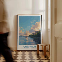 Framed Greenwich London travel poster with ship illustration leaning against wall, man walking by