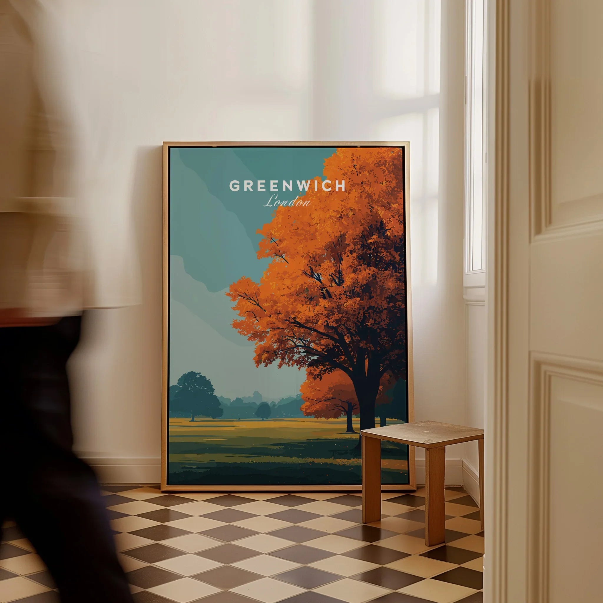 Framed Greenwich London travel poster with autumn tree on checkered floor, man walking past