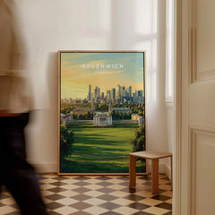 Framed Greenwich London travel poster on floor, man walking past in modern entryway