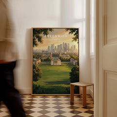 Framed Greenwich London travel poster on floor, city skyline artwork in sunlit hallway