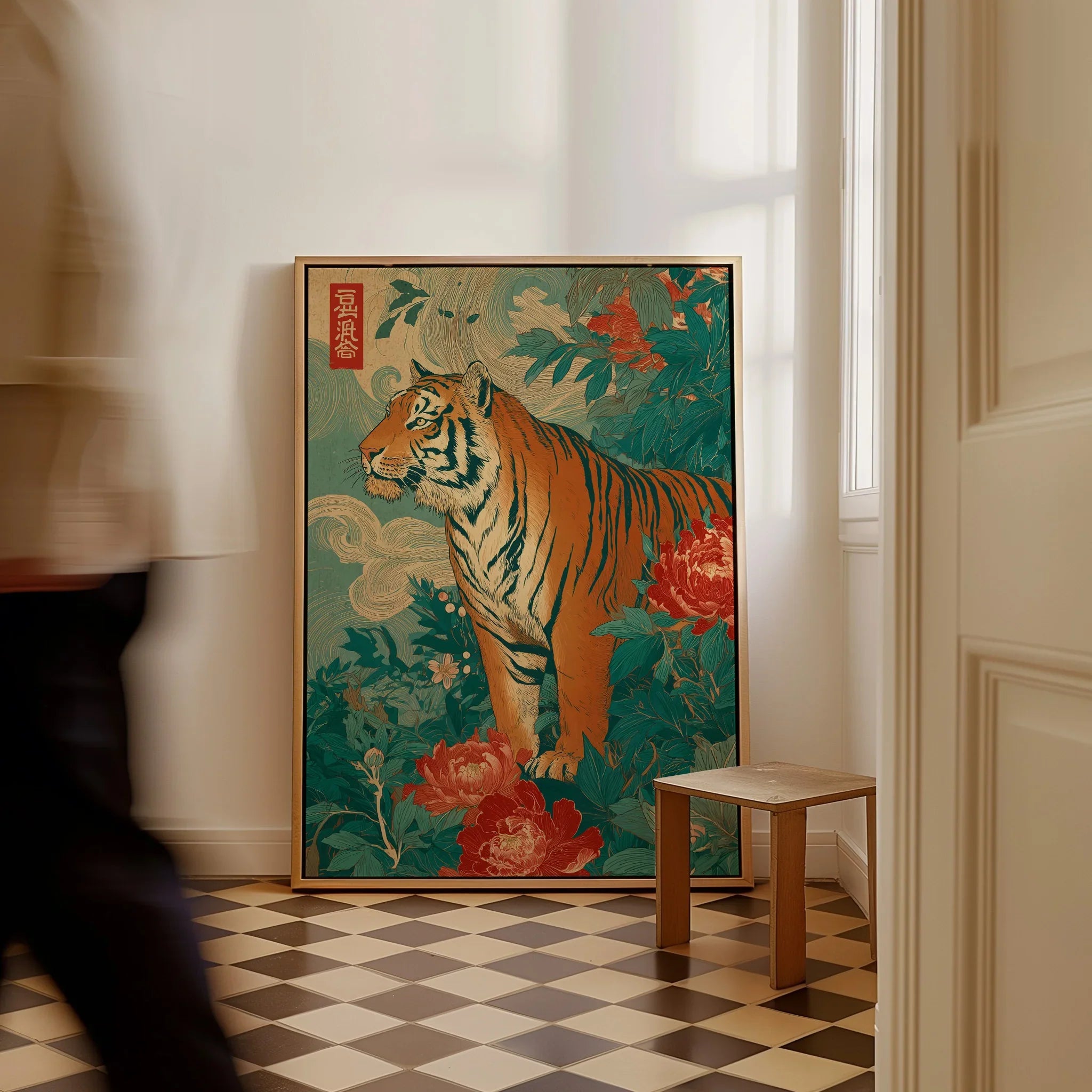 Framed Japanese tiger art print with floral design leaning on floor in modern hallway.