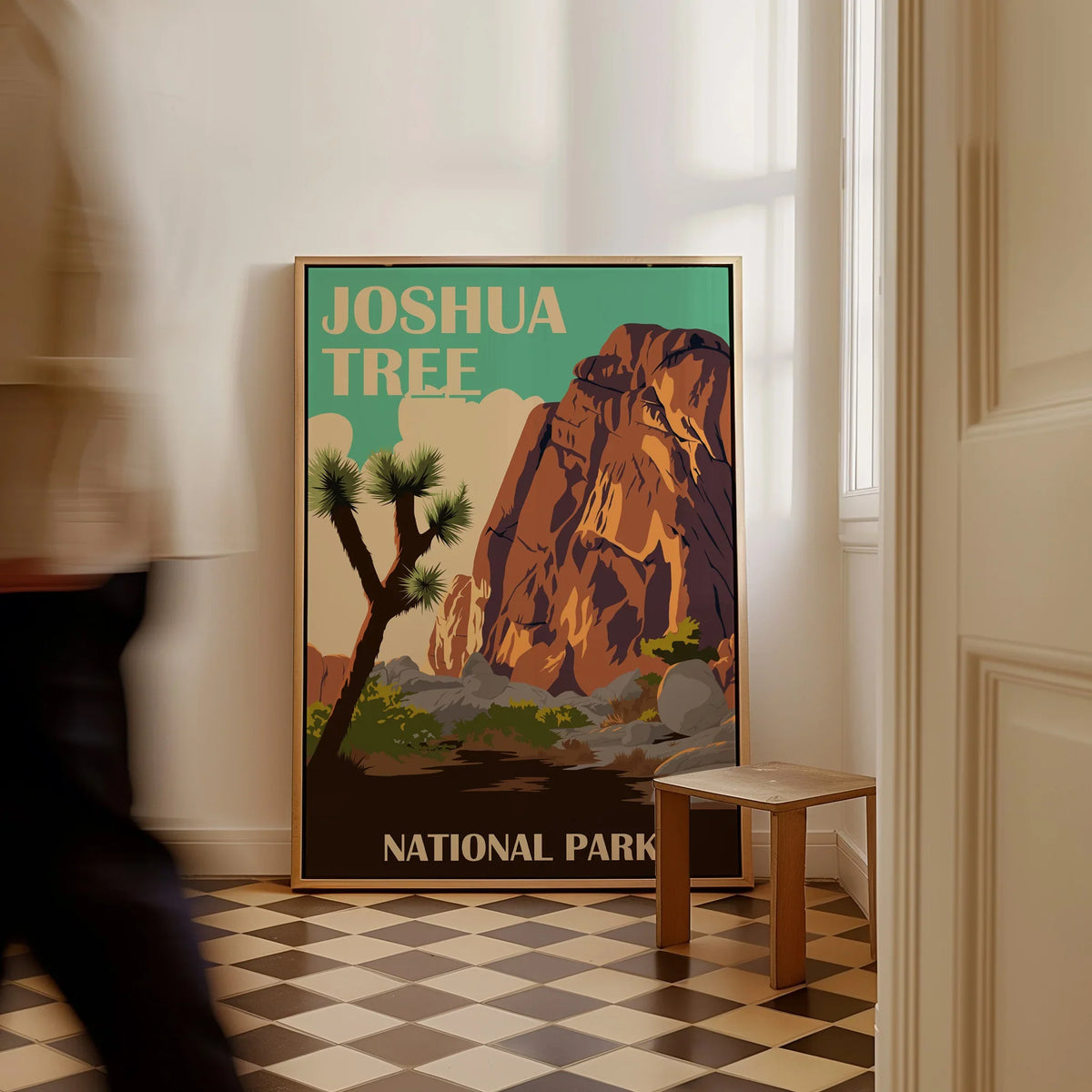 Framed Joshua Tree National Park travel poster on floor in modern home entryway