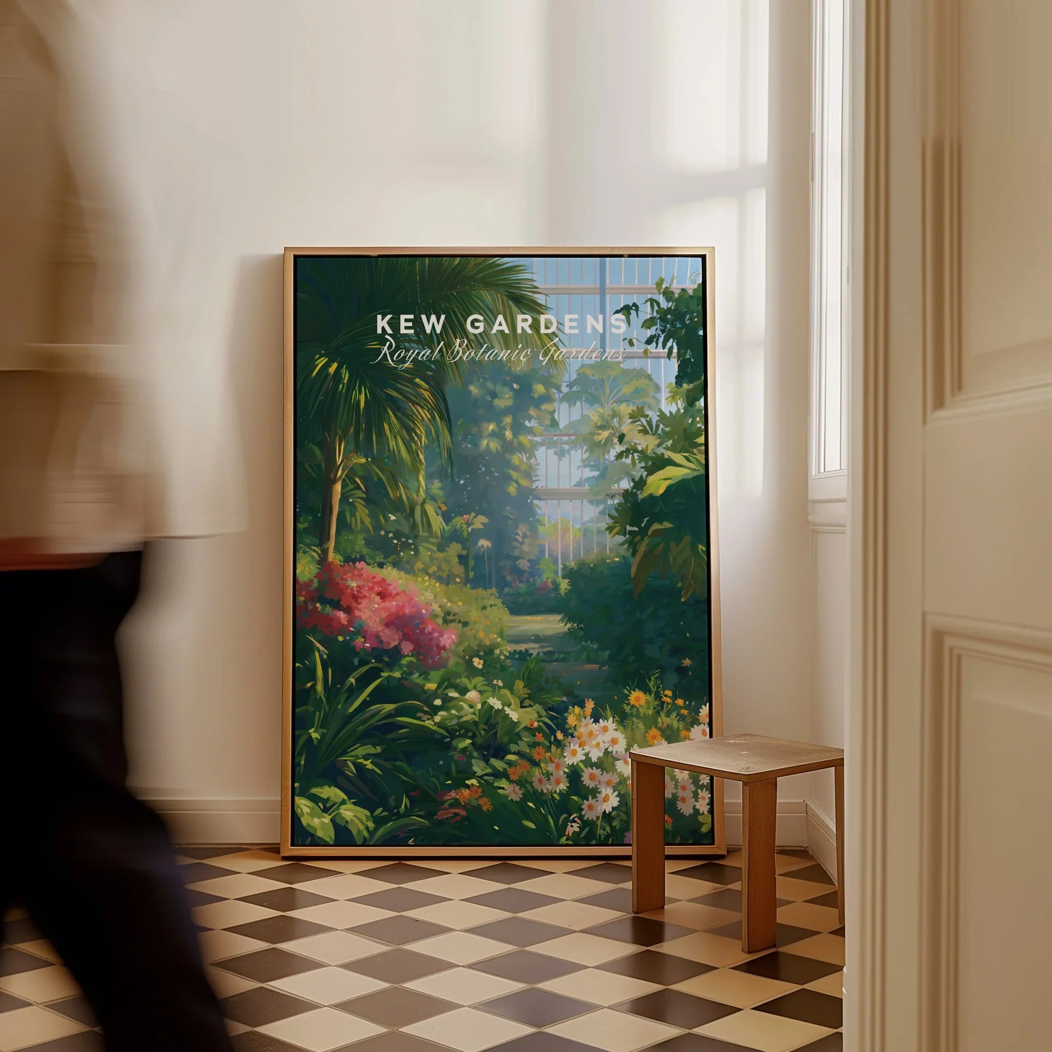 Framed Kew Gardens botanical art print on floor in sunlit room, person walking past