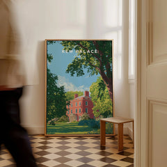 Framed Kew Palace travel poster on checkered floor, sunlight through window, person walking by