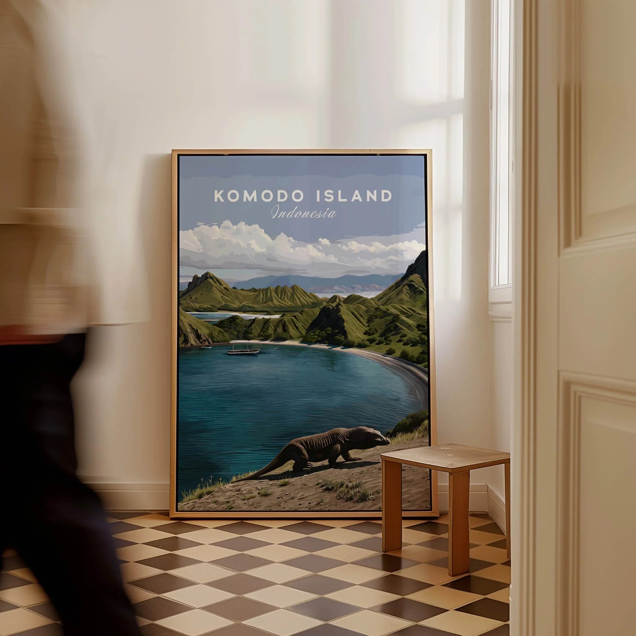 Framed Komodo Island travel poster with coastal landscape and Komodo dragon on floor indoors