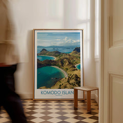 Komodo Island travel poster framed on floor in modern home, man walking past