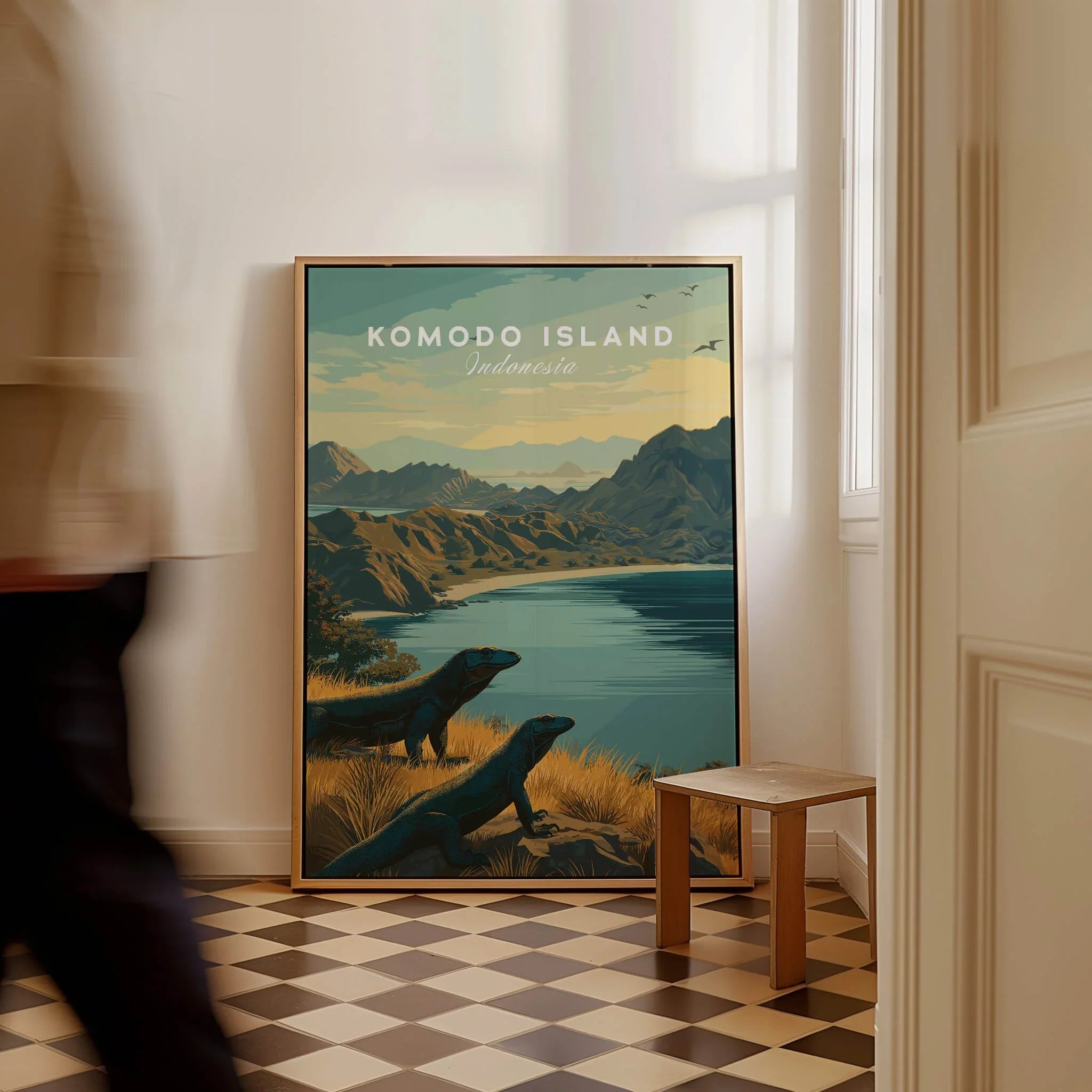 Framed Komodo Island travel poster art with Komodo dragons on floor in modern home entryway