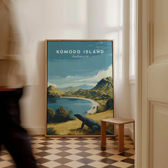Framed Komodo Island Indonesia travel poster with landscape art on floor, person walking past
