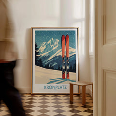 Framed Kronplatz Italy travel poster with mountains and skis, leaning on floor indoors