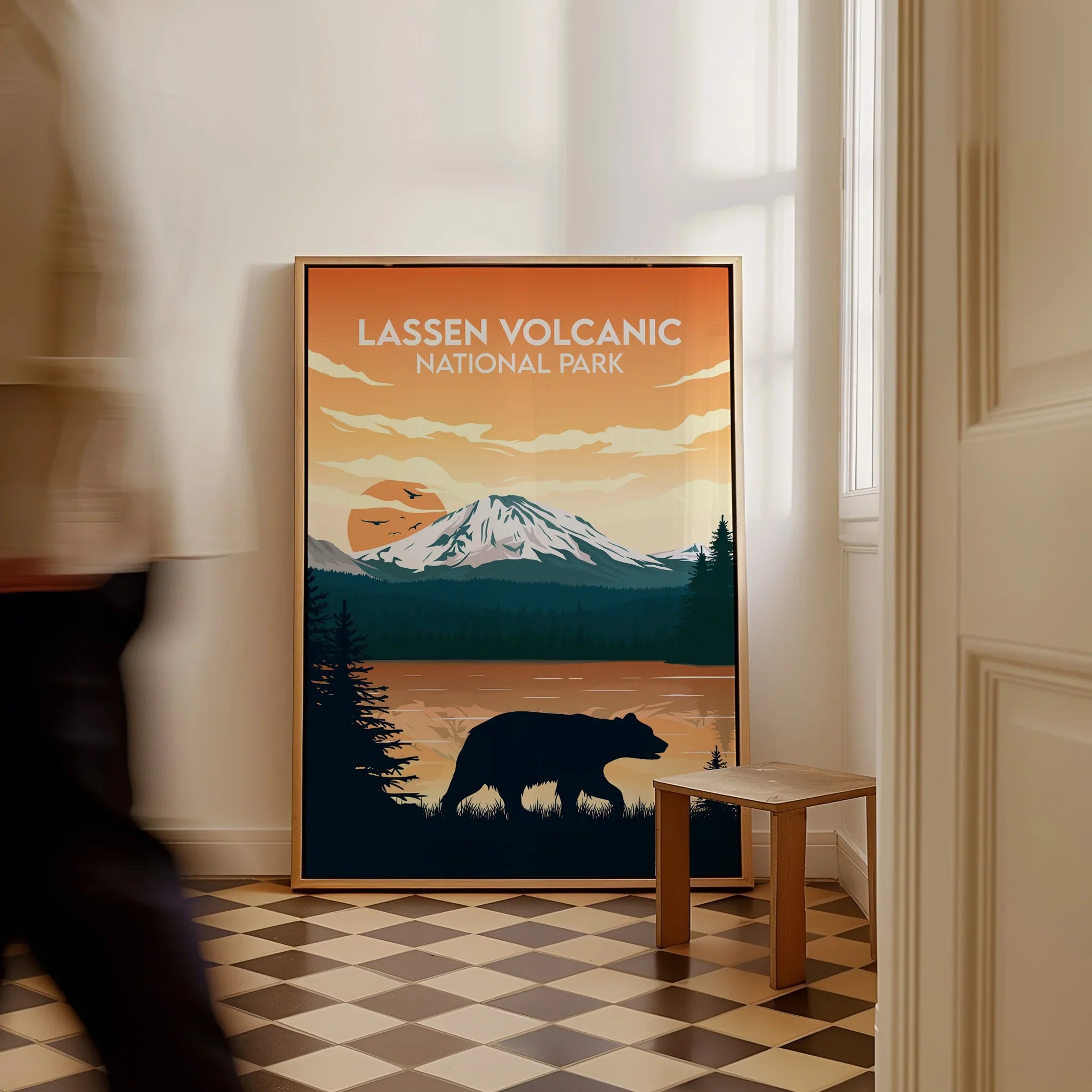 Framed Lassen Volcanic National Park poster with bear and mountain, leaning on floor