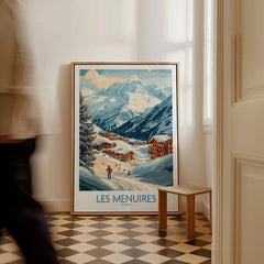Framed Les Menuires France travel poster with snowy mountain village, leaning on floor.