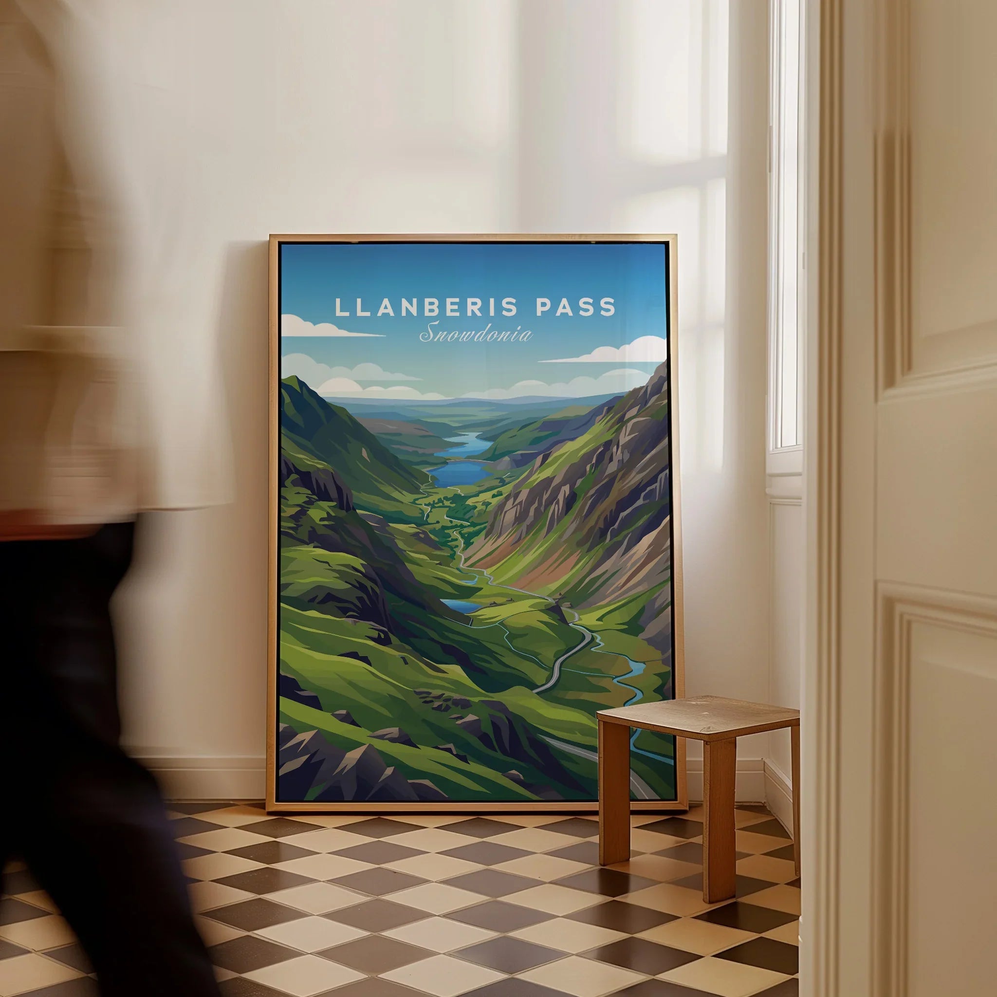 Llanberis Pass Snowdonia travel poster framed on the floor in a bright hallway