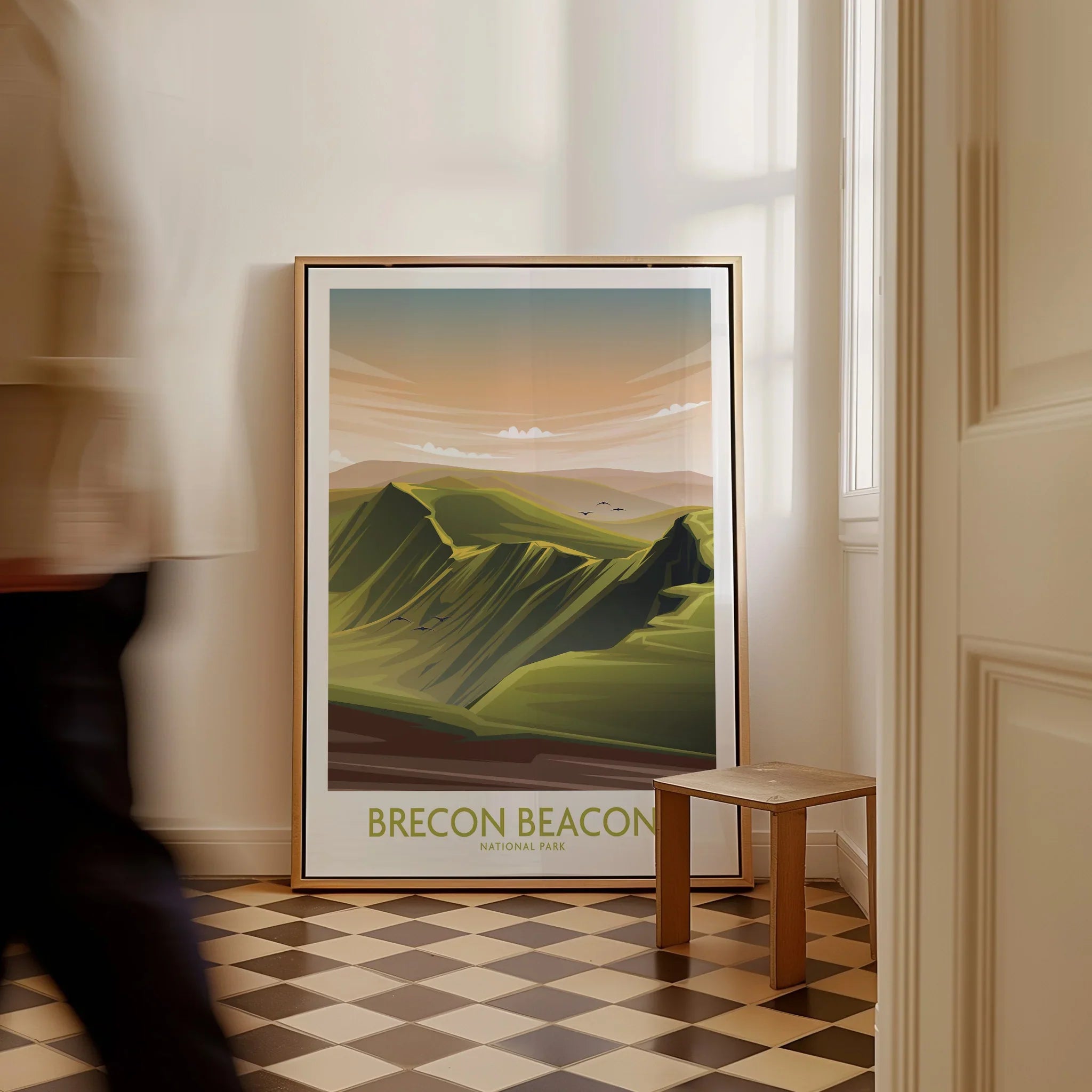 Framed Brecon Beacons National Park travel art poster on floor in a bright hallway