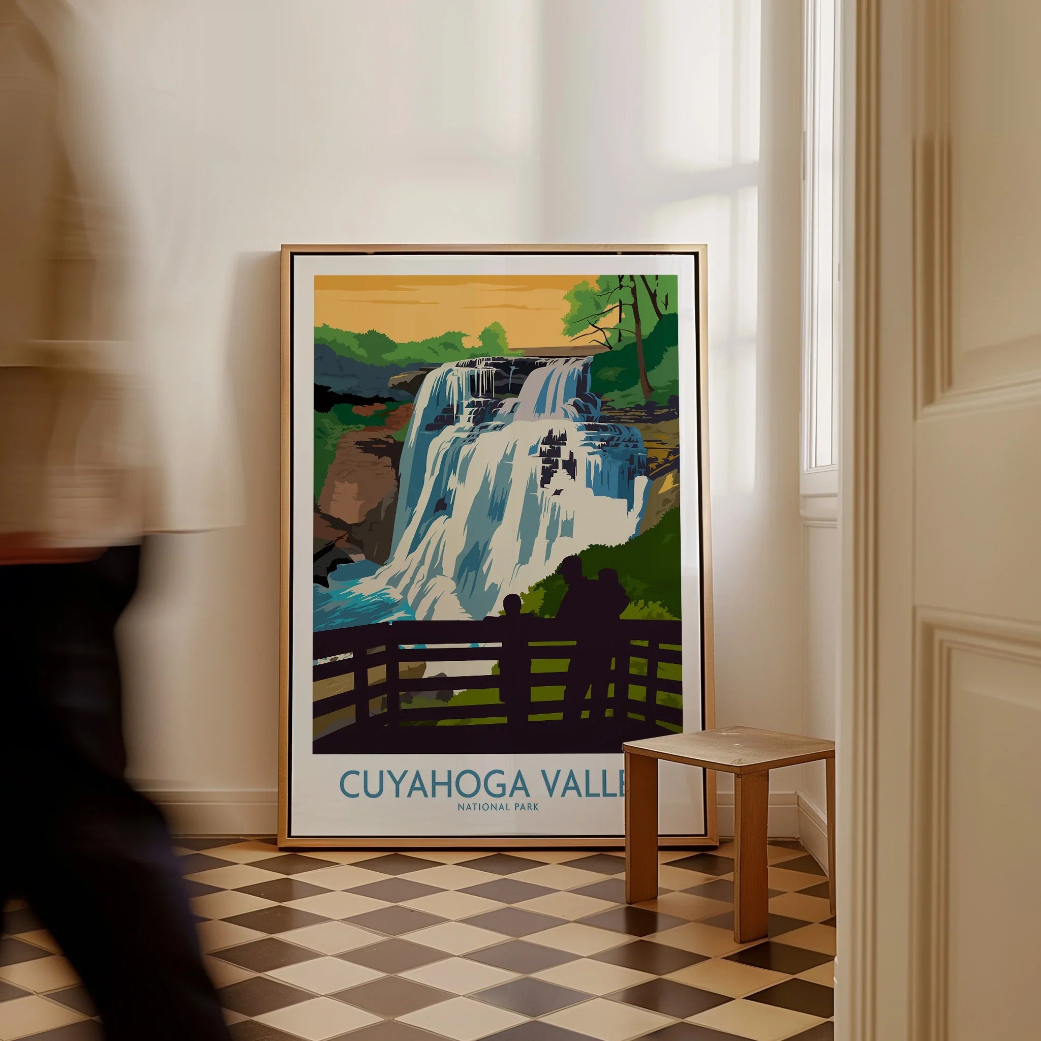 Framed Cuyahoga Valley National Park waterfall travel poster on the floor in a bright hallway