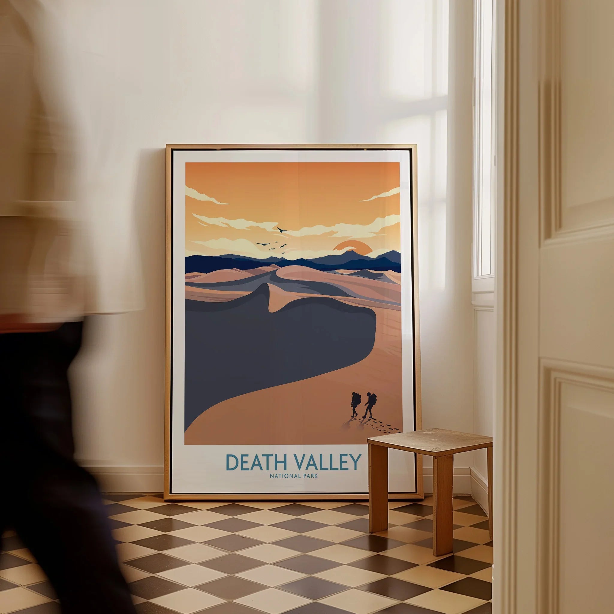 Framed Death Valley National Park poster with desert landscape leaning on the floor