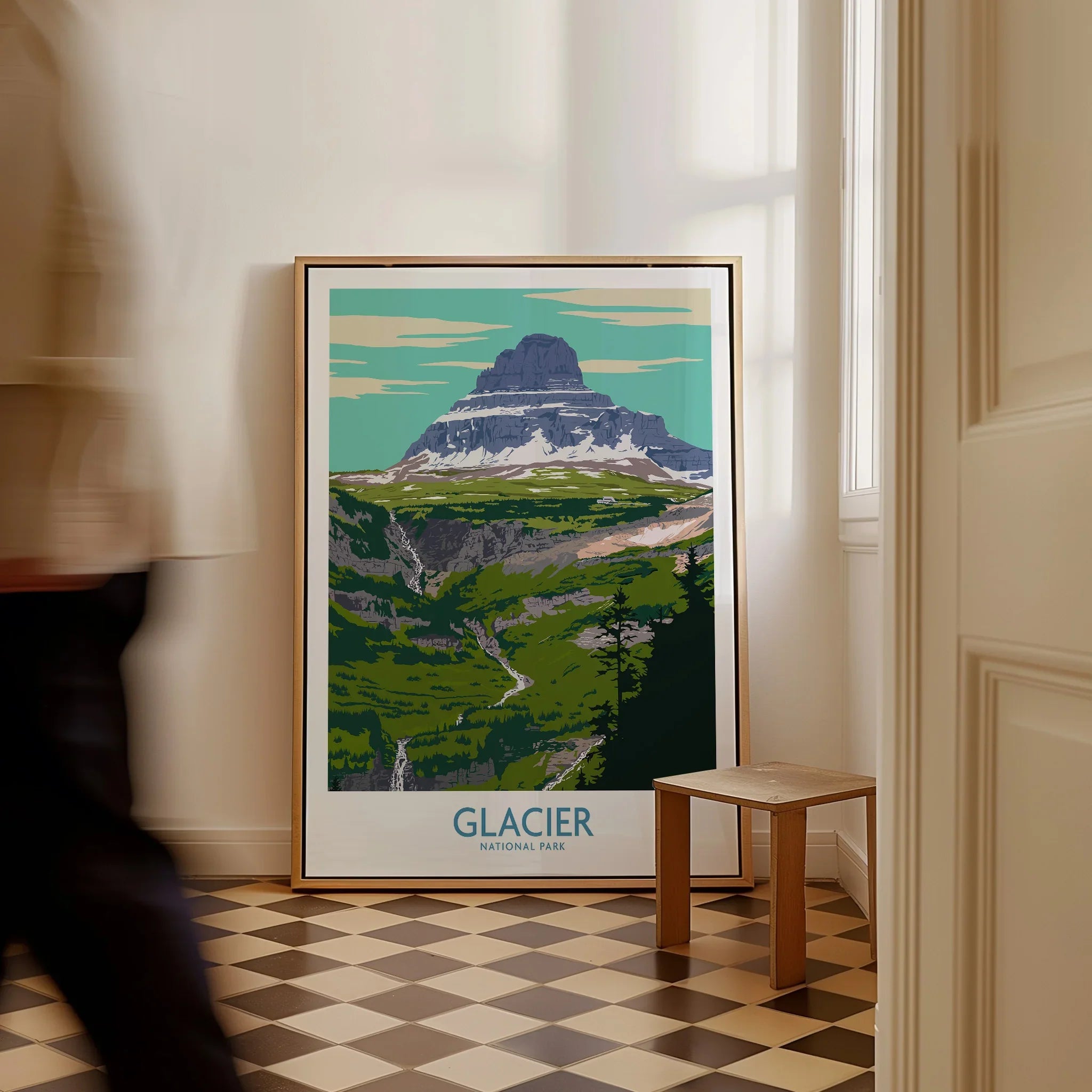Glacier National Park travel poster framed on floor in modern home interior