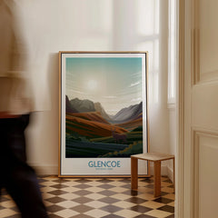 Framed Glencoe National Park travel poster with mountain landscape leaning on floor in hallway