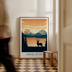 Framed Grand Teton National Park travel poster with mountains and deer on a hallway floor