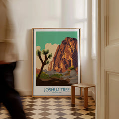 Framed Joshua Tree National Park art print on floor in bright hallway, person walking past