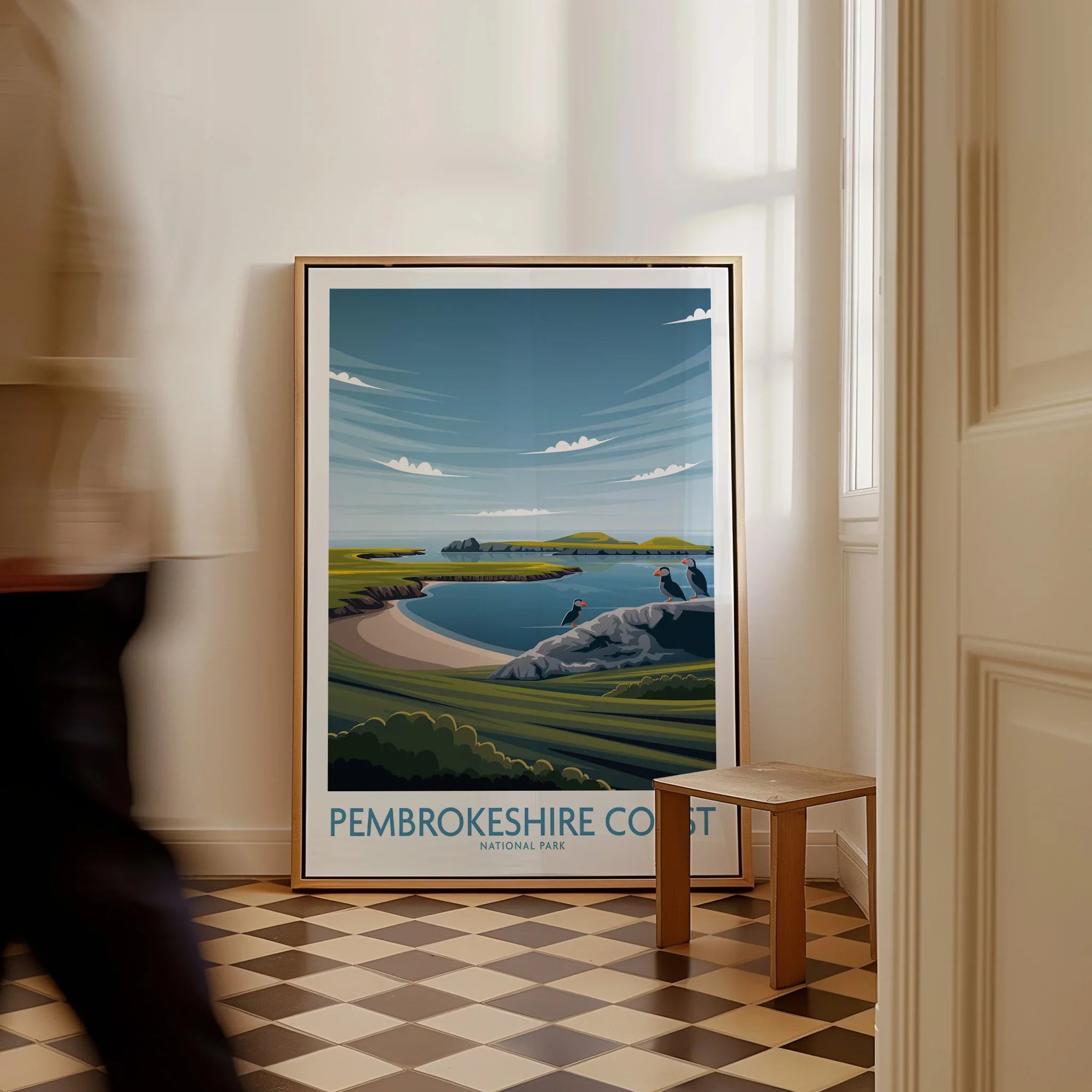 Framed Pembrokeshire Coast National Park art print leaning on wall in bright hallway