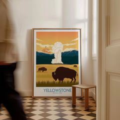 Framed Yellowstone National Park travel poster with bison and geyser leaning on floor