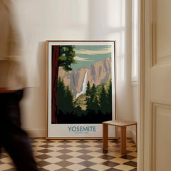 Framed Yosemite National Park travel poster with waterfall, placed on checkered floor indoors