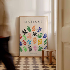 Matisse Art Prints - Colorful Abstract Shapes Scatter Print displayed in a stylish interior with vibrant cut-out shapes.