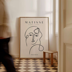 Matisse Art Prints - Continuous Line Abstract Face Poster displayed in a stylish interior setting.