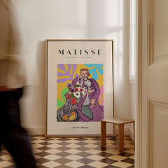 Matisse Art Prints - Stylized Woman with Flowers Fruit Still Life Interior Poster displayed in a stylish room.