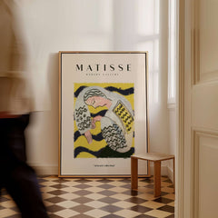 Matisse Art Prints - Resting Woman Patterned Blouse Yellow displayed in an elegant interior setting with patterned flooring.