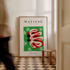 Matisse Art Prints -  Abstract Shape Red Green Poster displayed in a stylish room setting with a wooden chair.