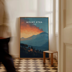 Framed Mount Etna travel poster print leaning on floor in bright modern home interior