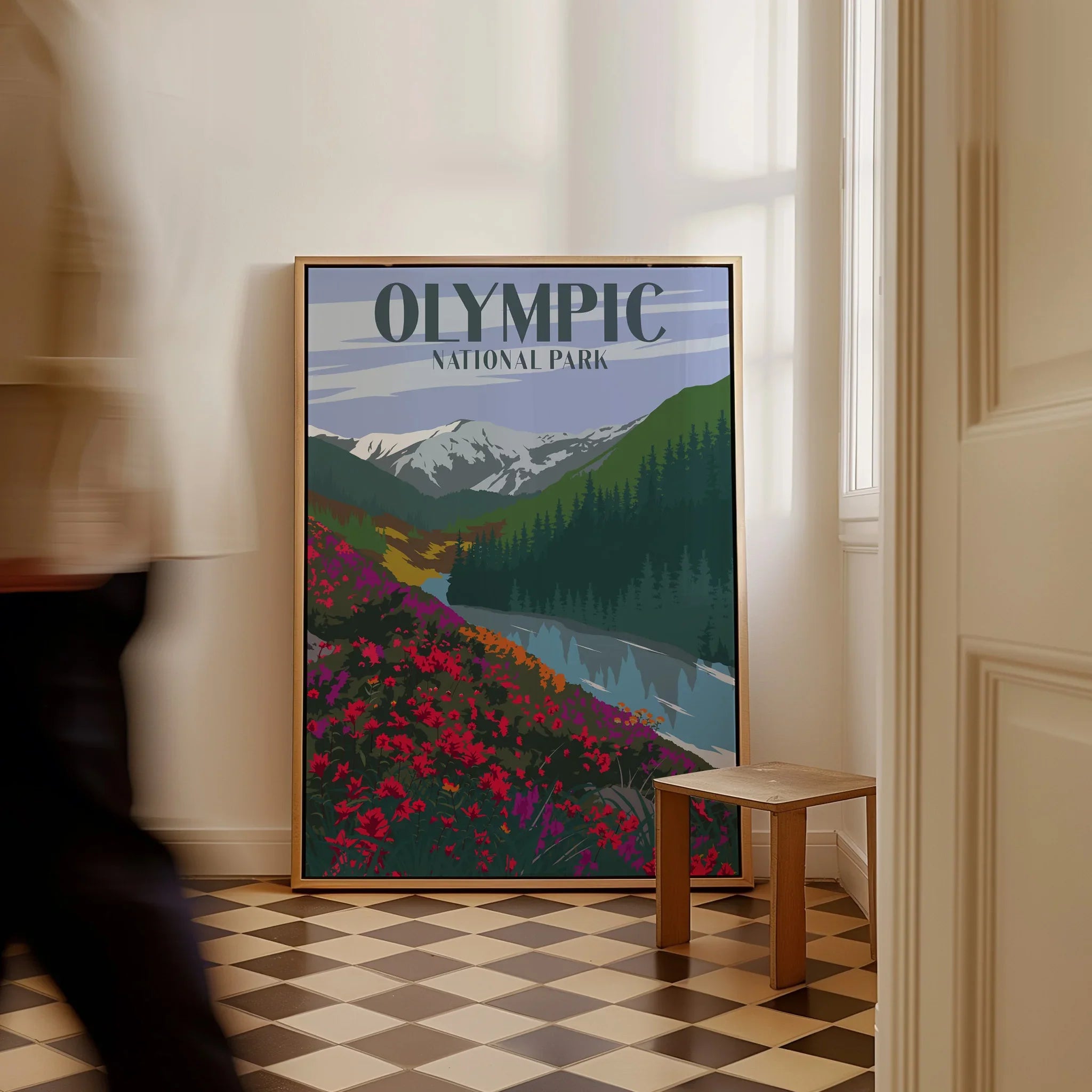 Olympic National Park travel poster art with mountains and wildflowers, framed on floor