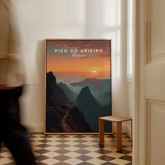 Framed Pico do Arieiro Madeira travel poster with mountain landscape on floor, man walking past.