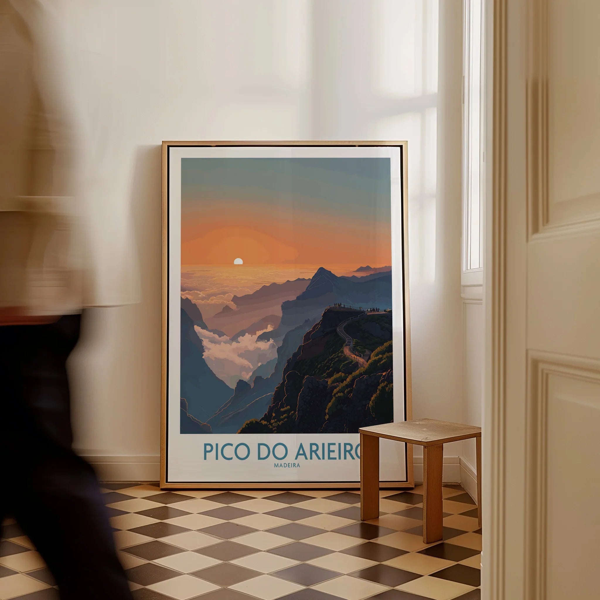 Framed Pico do Arieiro Madeira travel poster on floor, sunset mountains, man walking past